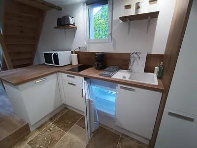 Cuisine ou kitchenette dans l'établissement Le petit duplex des barres