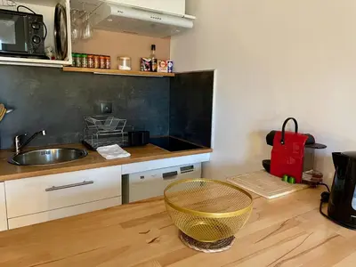 Cuisine ou kitchenette dans l'établissement Lumineux duplex plage à pied