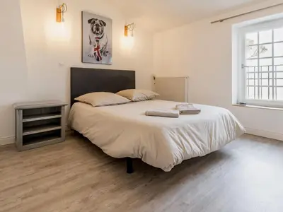 Un ou plusieurs lits dans un hébergement de l'établissement Maison de charme avec jardin près de Nantes, 4 chambres, wifi, équipements bébé et babyfoot - FR-1-306-1272