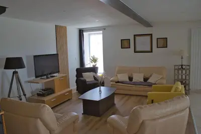 Télévision ou salle de divertissement dans l'établissement Gîte à la ferme - le Boupère