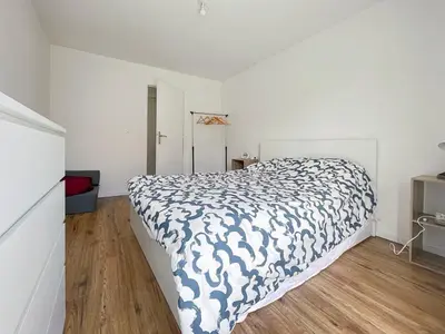 Un ou plusieurs lits dans un hébergement de l'établissement L'Atelier Bleu - Cosy et Lumineux