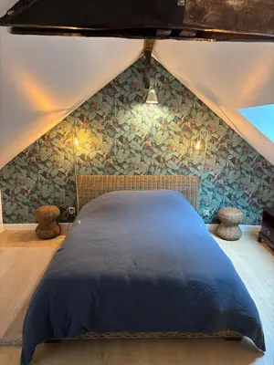 Un ou plusieurs lits dans un hébergement de l'établissement Le Cottage de Cardunel