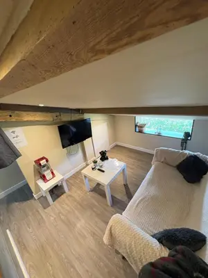 Télévision ou salle de divertissement dans l'établissement Maison de la barbotine