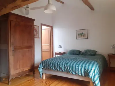 Un ou plusieurs lits dans un hébergement de l'établissement Chambres d'hôtes de la Barbinière