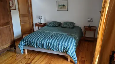 Un ou plusieurs lits dans un hébergement de l'établissement Chambres d'hôtes de la Barbinière