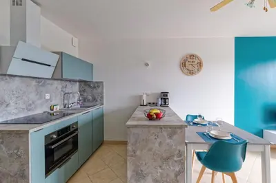 Cuisine ou kitchenette dans l'établissement L'Escale des Jaunais - A moins d'1 km de la plage