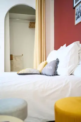 Un ou plusieurs lits dans un hébergement de l'établissement La Suite des Carmes - Studio cosy