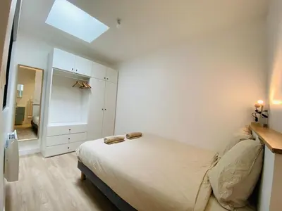 Un ou plusieurs lits dans un hébergement de l'établissement Casa Gardot