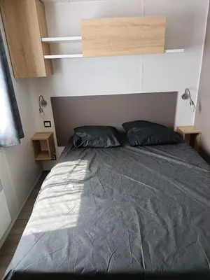 Un ou plusieurs lits dans un hébergement de l'établissement MH 329 Camping Bois Dormant