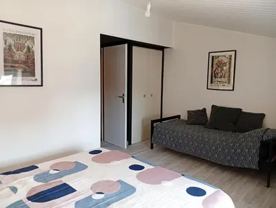 Un ou plusieurs lits dans un hébergement de l'établissement Duplex vue sur château