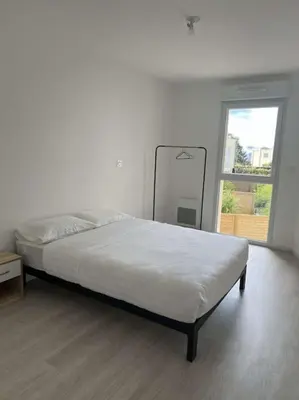 Un ou plusieurs lits dans un hébergement de l'établissement Appartement proche gare et centre-ville
