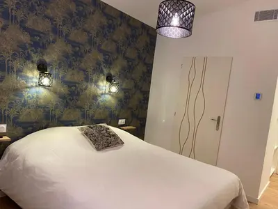 Un ou plusieurs lits dans un hébergement de l'établissement La Maison Blanche