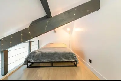 Un ou plusieurs lits dans un hébergement de l'établissement Studio de la petite Escapade
