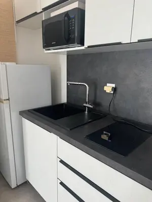 Cuisine ou kitchenette dans l'établissement La Lumière du Coeur