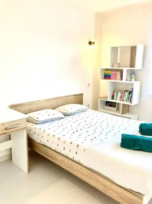 Un ou plusieurs lits dans un hébergement de l'établissement Maison spacieuse avec jardin à 25min des Sables
