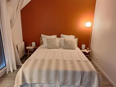 Un ou plusieurs lits dans un hébergement de l'établissement Saint Jo Verte, chambre d' hôte Quartier Beaujoire Parc des expositions Parc Floral