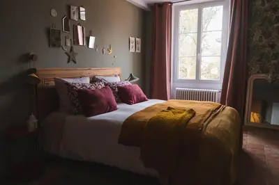 Un ou plusieurs lits dans un hébergement de l'établissement Maison d'hôtes La bien-Aimée