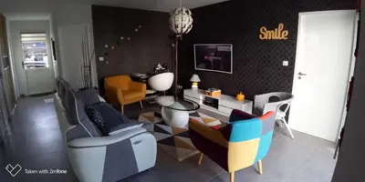 Coin salon dans l'établissement Très belle maison avec SPA extérieur