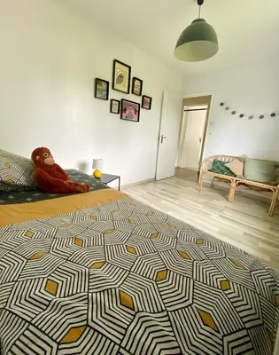 Un ou plusieurs lits dans un hébergement de l'établissement Bel appartement Nantes