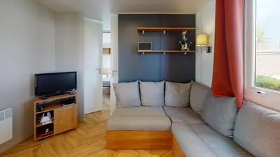 Télévision ou salle de divertissement dans l'établissement Mobil Home avec Clim La Plage