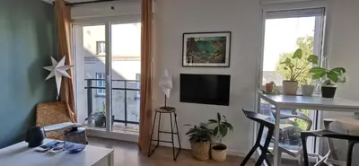 Télévision ou salle de divertissement dans l'établissement Appart T2 l'île de Nantes avec parking privé