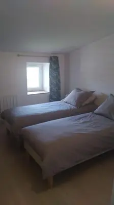 Un ou plusieurs lits dans un hébergement de l'établissement Maison à la campagne