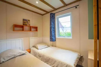 Un ou plusieurs lits dans un hébergement de l'établissement ZEcamping 4 jacuzzi piscine chauffée à 1km de la plage pet friendly
