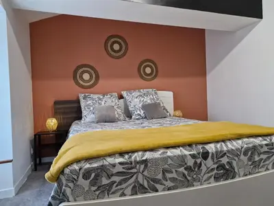 Un ou plusieurs lits dans un hébergement de l'établissement Le Cardoué, chambres d'hôtes proche du Puy duFou