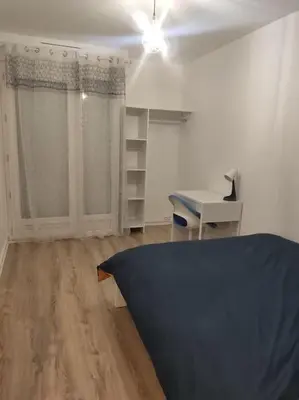 Un ou plusieurs lits dans un hébergement de l'établissement Appartement Cosy, 3 Chambres près du centre ville