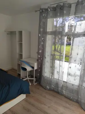 Un ou plusieurs lits dans un hébergement de l'établissement Appartement Cosy, 3 Chambres près du centre ville