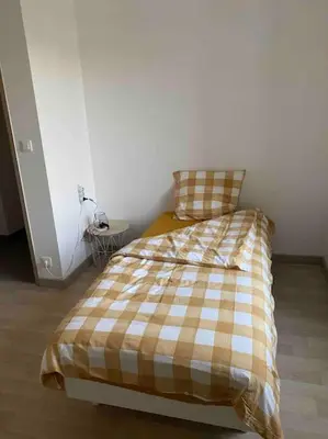 Un ou plusieurs lits dans un hébergement de l'établissement L'appartement des tortues