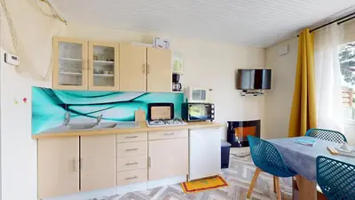 Cuisine ou kitchenette dans l'établissement Nid Douillet Terre et Mer
