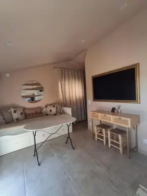 Télévision ou salle de divertissement dans l'établissement Dar Fafy studio cosy au calme à 15min de Nantes