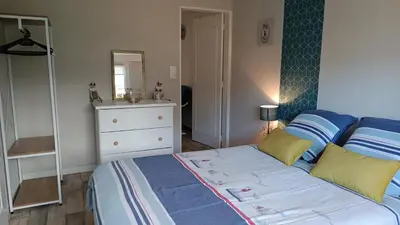 Un ou plusieurs lits dans un hébergement de l'établissement Appartement RdC en bordure de forêt