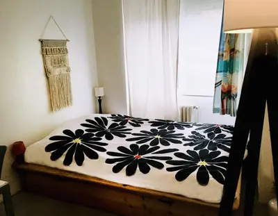 Un ou plusieurs lits dans un hébergement de l'établissement Chambre ville & campagne