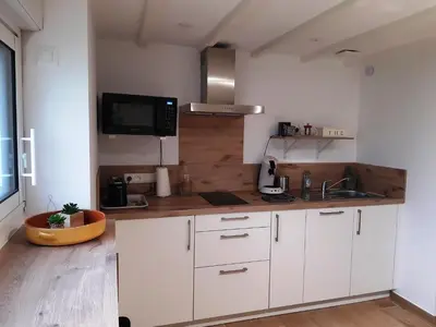 Cuisine ou kitchenette dans l'établissement Grange Rénovée 5 personnes-Gîte Le 411