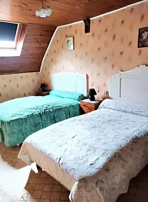 Un ou plusieurs lits dans un hébergement de l'établissement Maison charmante à Ombrée d'Anjou avec jardin et terrasse