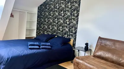 Coin salon dans l'établissement Appartement 3 chambres centre ville Cholet 25min du Puy duFou
