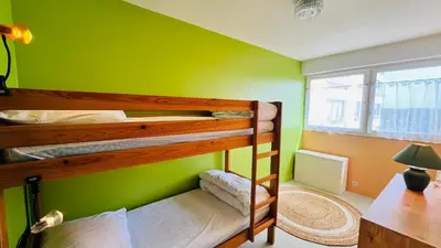 Un ou plusieurs lits dans un hébergement de l'établissement Appartement sable et océan