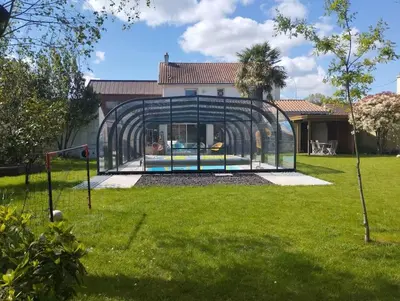 Jardin de l'établissement Grande maison familiale avec piscine couverte chauffée à 15 min du centre de Nantes