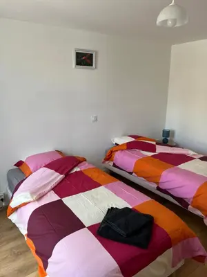 Un ou plusieurs lits dans un hébergement de l'établissement L'appartement des Perroquets