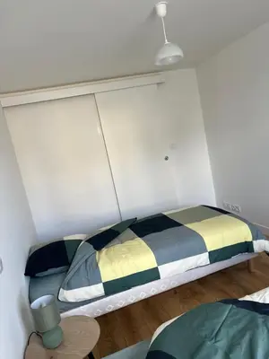 Un ou plusieurs lits dans un hébergement de l'établissement L'appartement des Perroquets