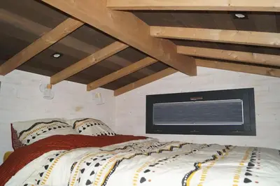 Un ou plusieurs lits dans un hébergement de l'établissement SPA & Tiny house à la campagne