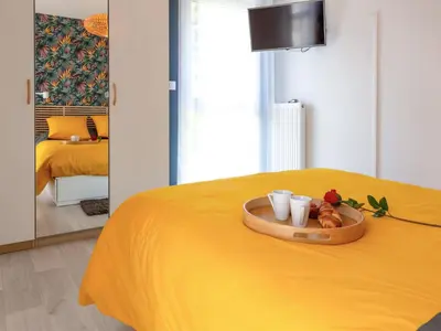 Un ou plusieurs lits dans un hébergement de l'établissement Apartment L'Indigo by Interhome