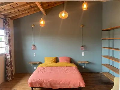 Un ou plusieurs lits dans un hébergement de l'établissement Loft spacieux