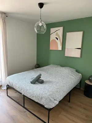 Un ou plusieurs lits dans un hébergement de l'établissement Le Contrie - Bel appartement avec terrasse