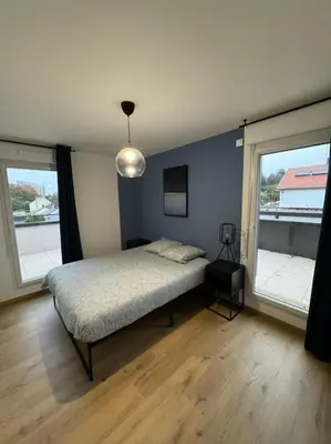 Un ou plusieurs lits dans un hébergement de l'établissement Le Contrie - Bel appartement avec terrasse