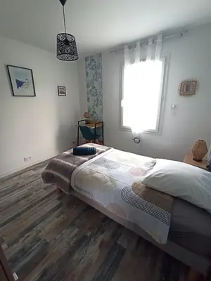 Un ou plusieurs lits dans un hébergement de l'établissement La Môme joli gîte à 15 min du Puy duFou