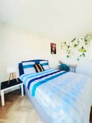 Un ou plusieurs lits dans un hébergement de l'établissement NOZA Appartement 65m2, 2 chambres - RDC, Parking gratuit, Nantes agglo Rezé
