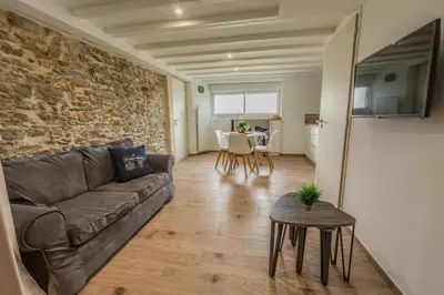 Coin salon dans l'établissement Grange Rénovée 3 pers-Le GrandLieu-Gîte Le 411